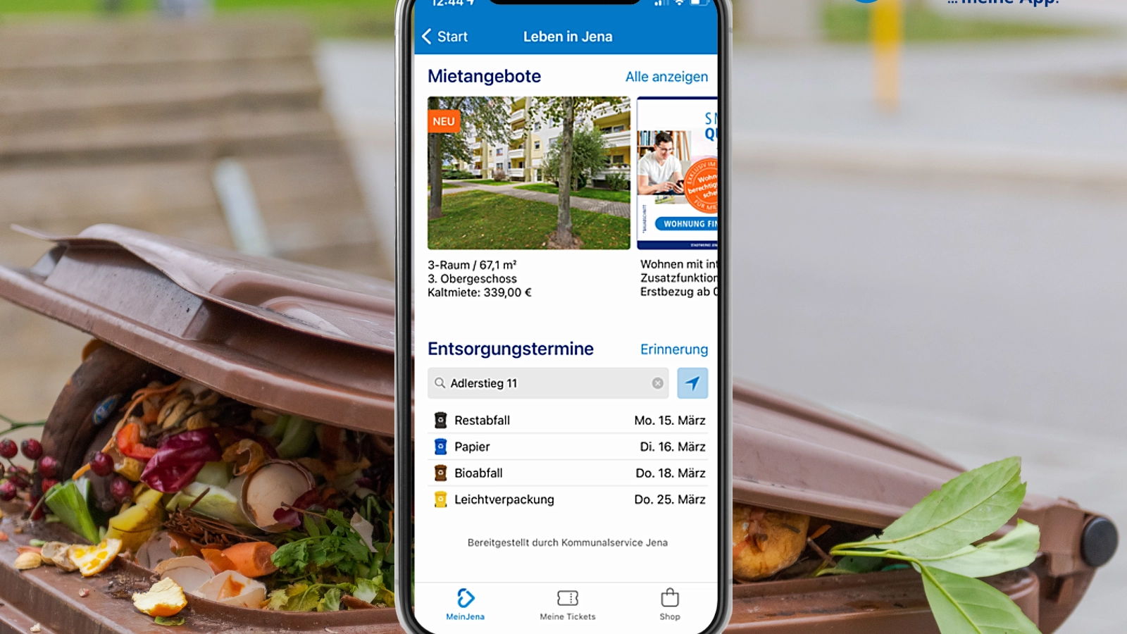 Symbolbild: Biomülltonne und ein Handy mit der App Mein Jena